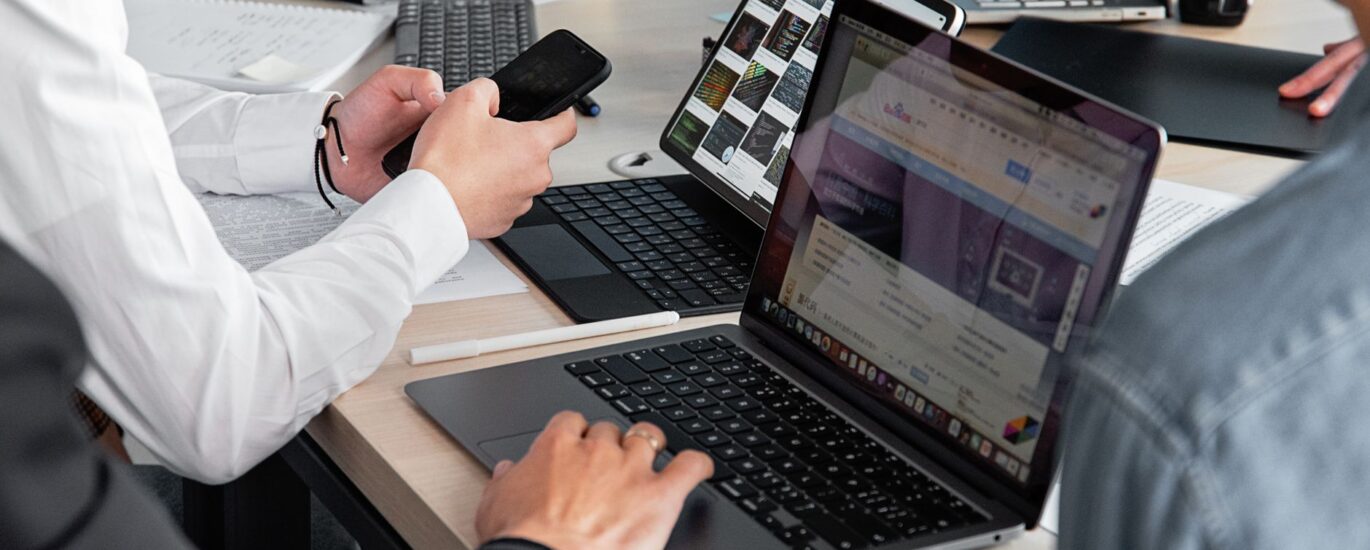 people working with modern electronic devices