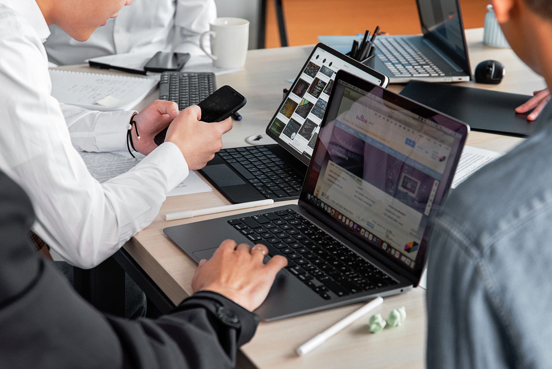 people working with modern electronic devices